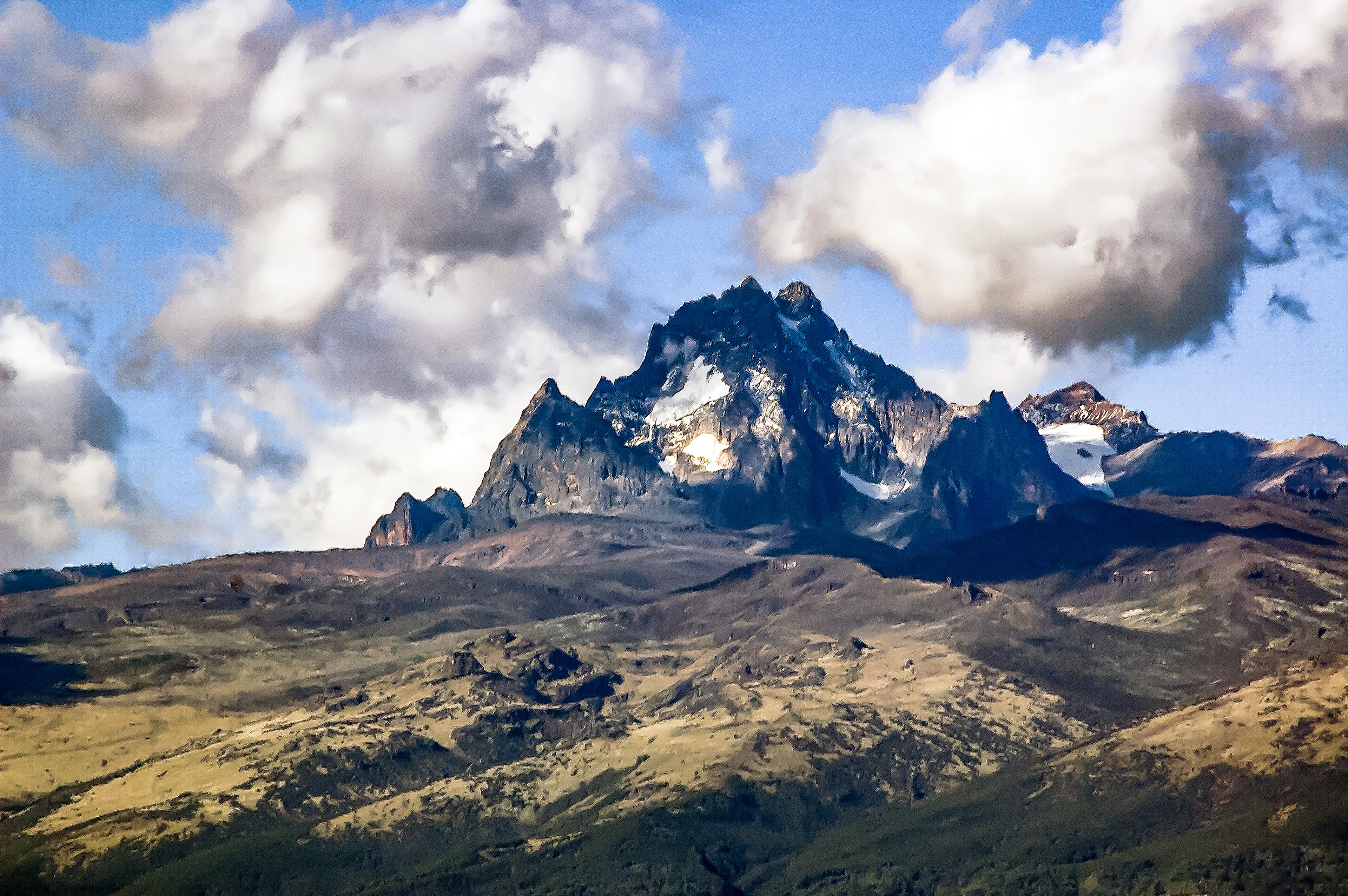 The high peaks of Mount Kenya beneath clouds